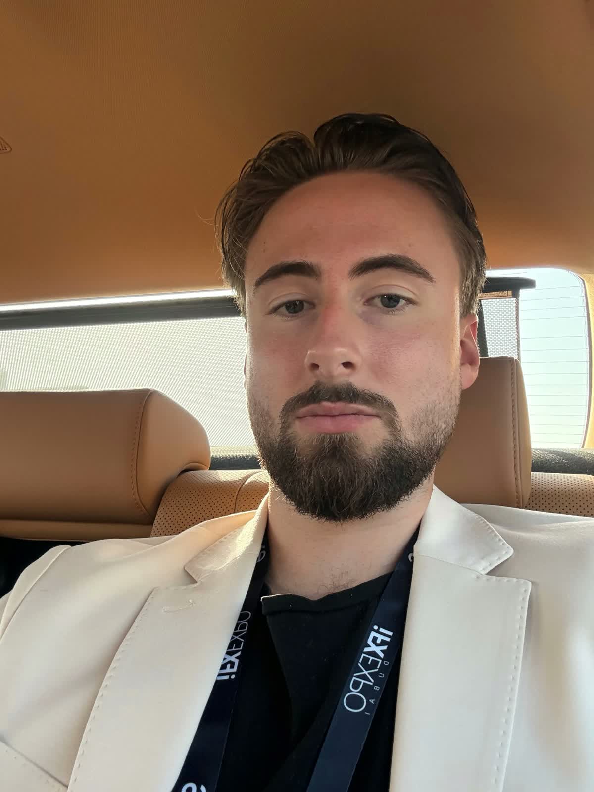 Simon Widblom wearing an iFXEXPO badge in Dubai